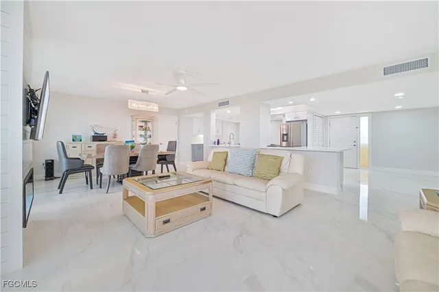 a living room with furniture and a table