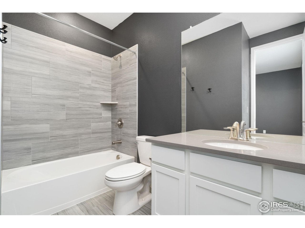 2883 Storm View Court Timnath, CO 80547 - Photo 15 of 36 a bathroom with a sink toilet vanity and tub