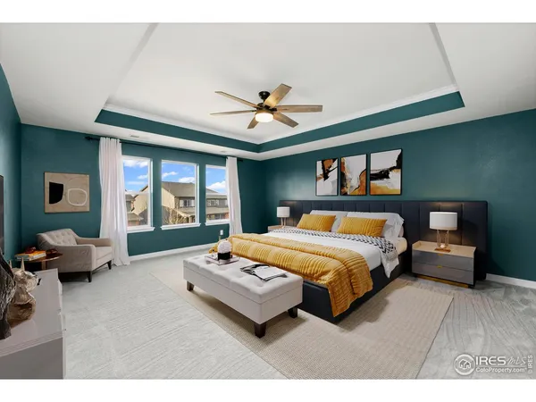 a spacious bedroom with a bed and wooden floor