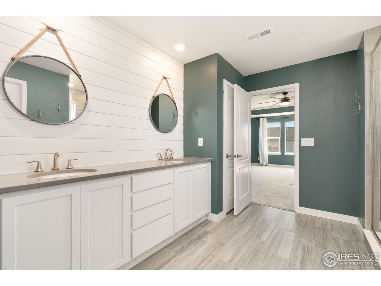 2883 Storm View Court Timnath, CO 80547 - Photo 19 of 36 a bathroom with a sink and a mirror