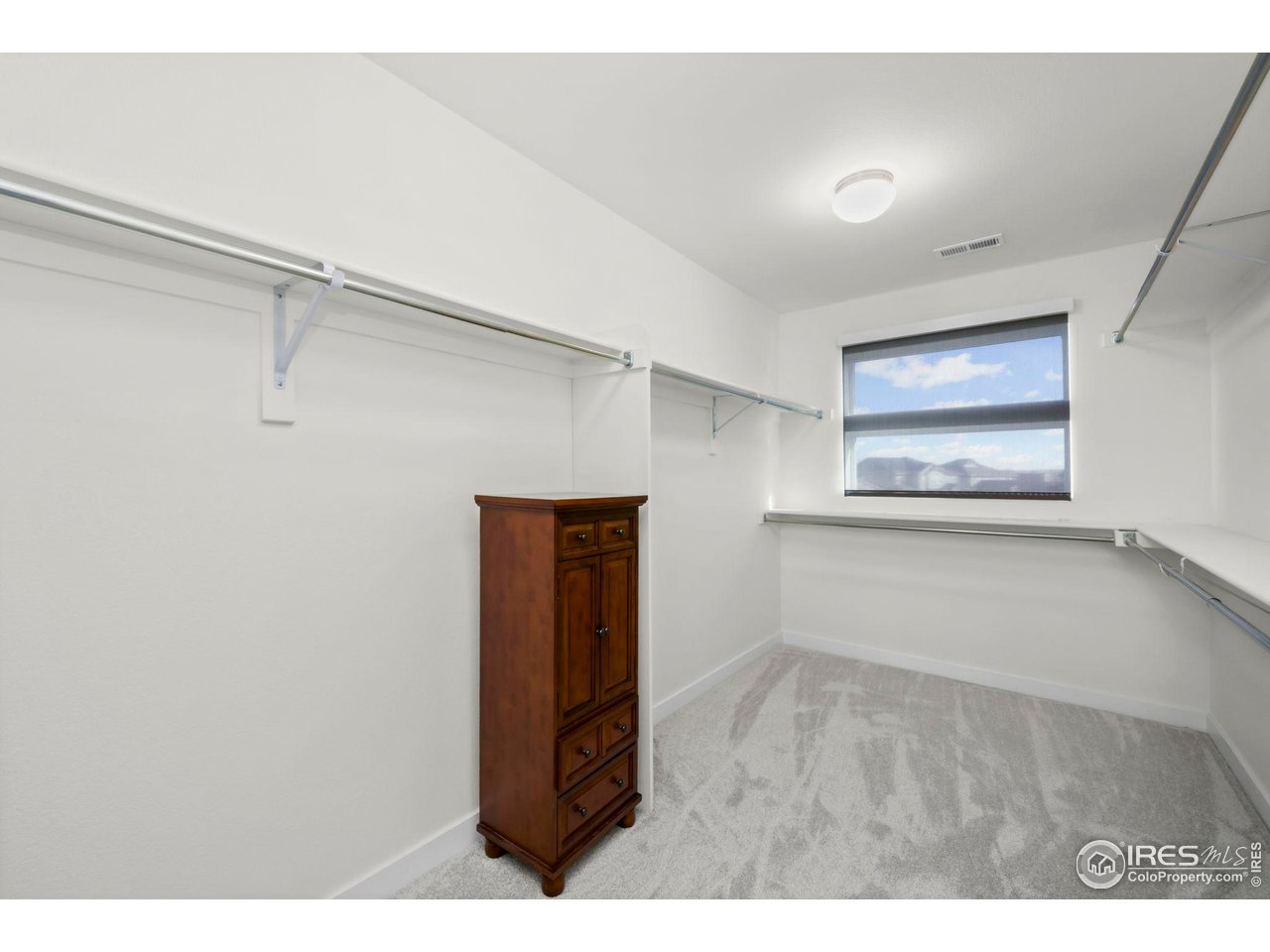 2883 Storm View Court Timnath, CO 80547 - Photo 20 of 36 a view of an empty room with a window
