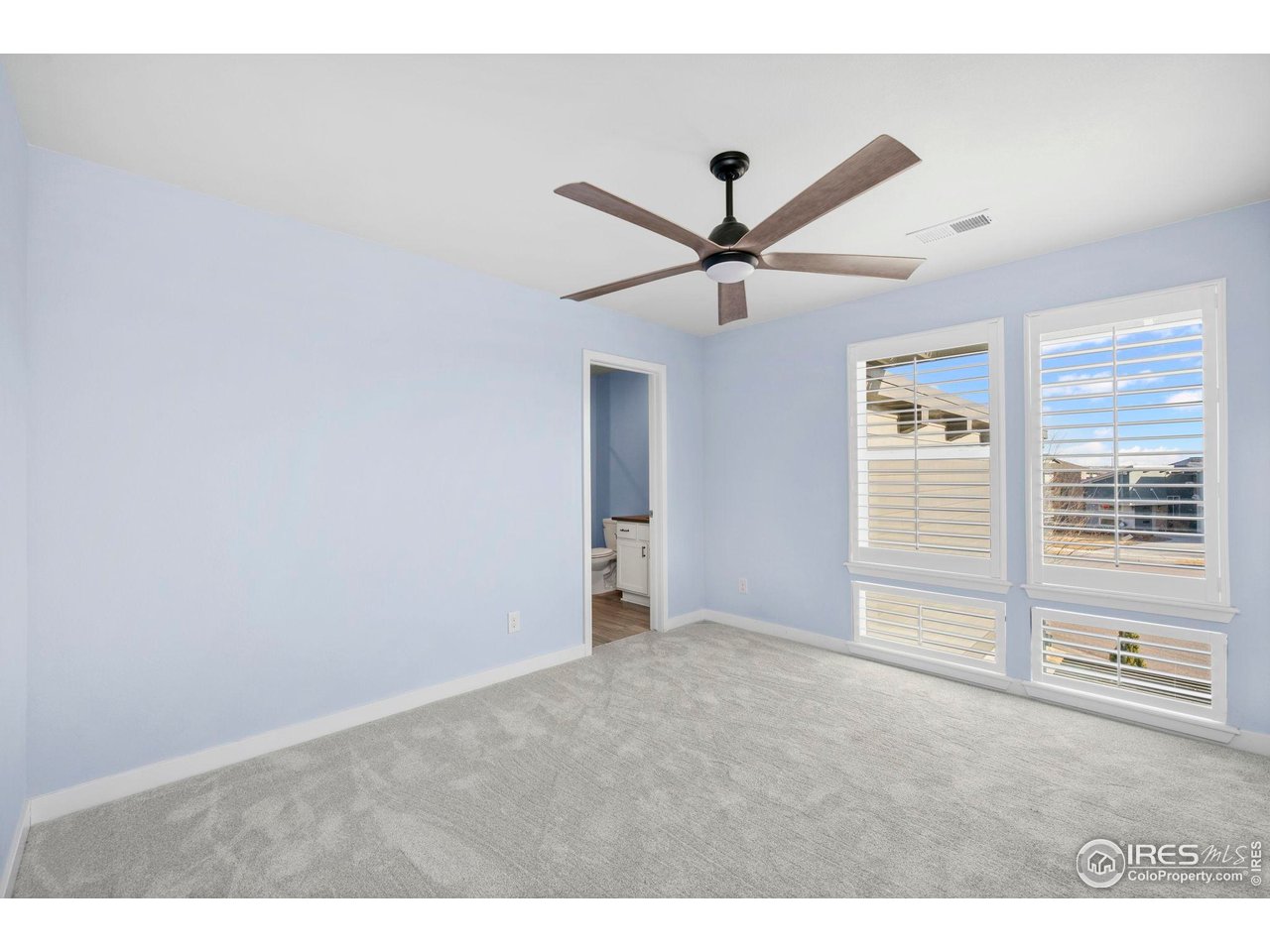 2883 Storm View Court Timnath, CO 80547 - Photo 22 of 36 a view of an empty room with a window