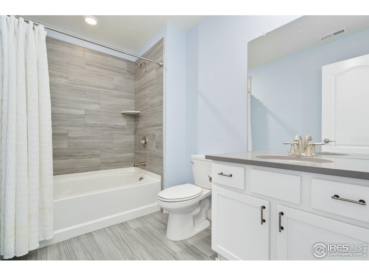 2883 Storm View Court Timnath, CO 80547 - Photo 23 of 36 a bathroom with a sink a toilet and a bathtub