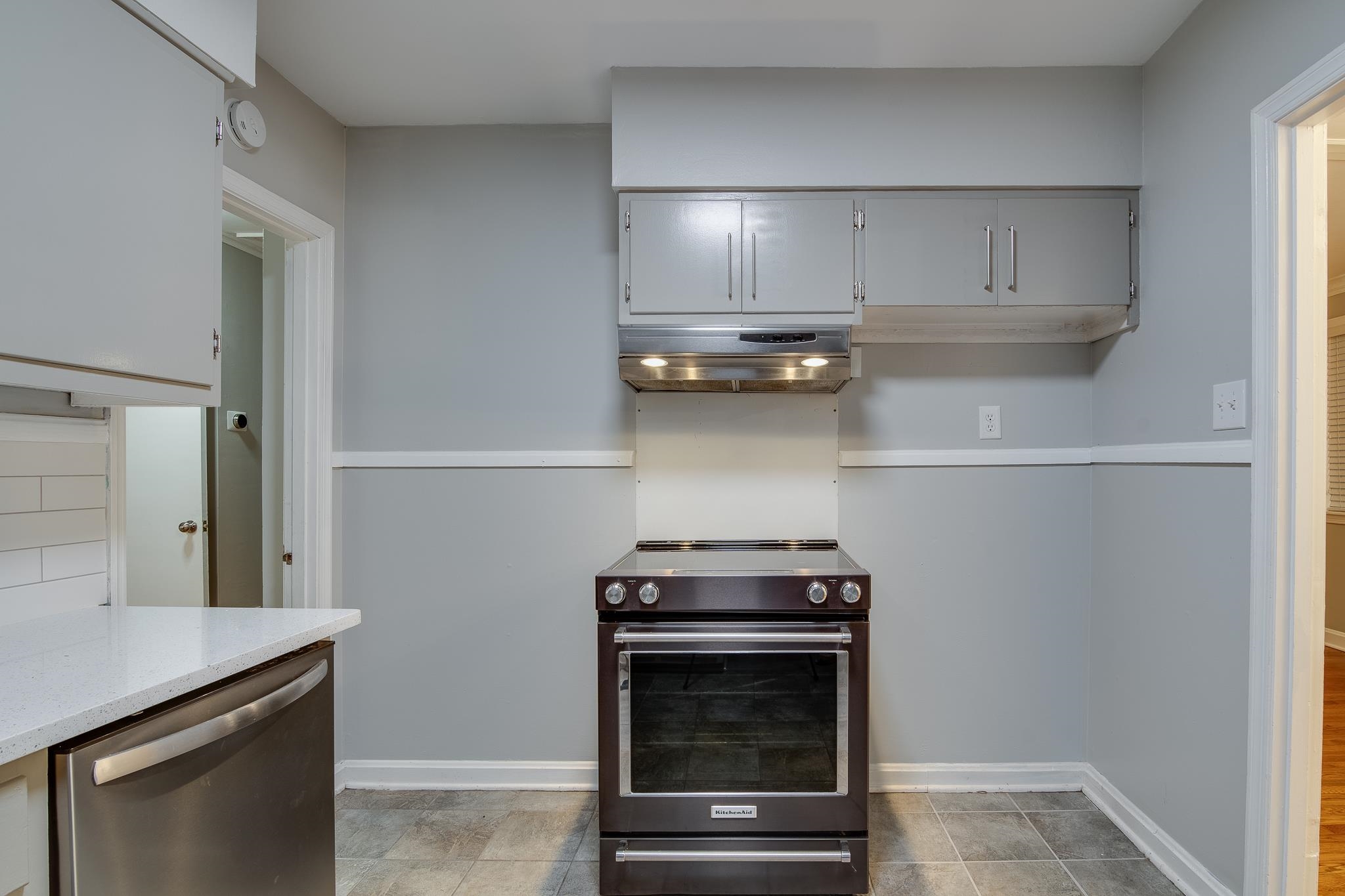 4970 Sequoia Road Memphis, TN 38117 - Photo 11 of 31 a stove top oven sitting inside of a kitchen