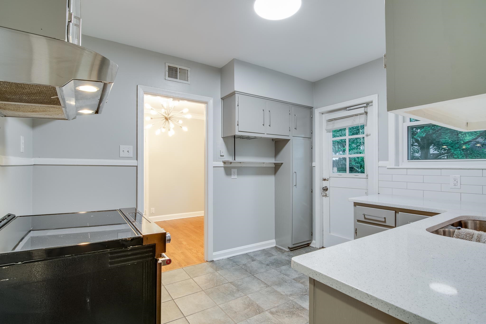 4970 Sequoia Road Memphis, TN 38117 - Photo 12 of 31 a kitchen with a stove and a refrigerator