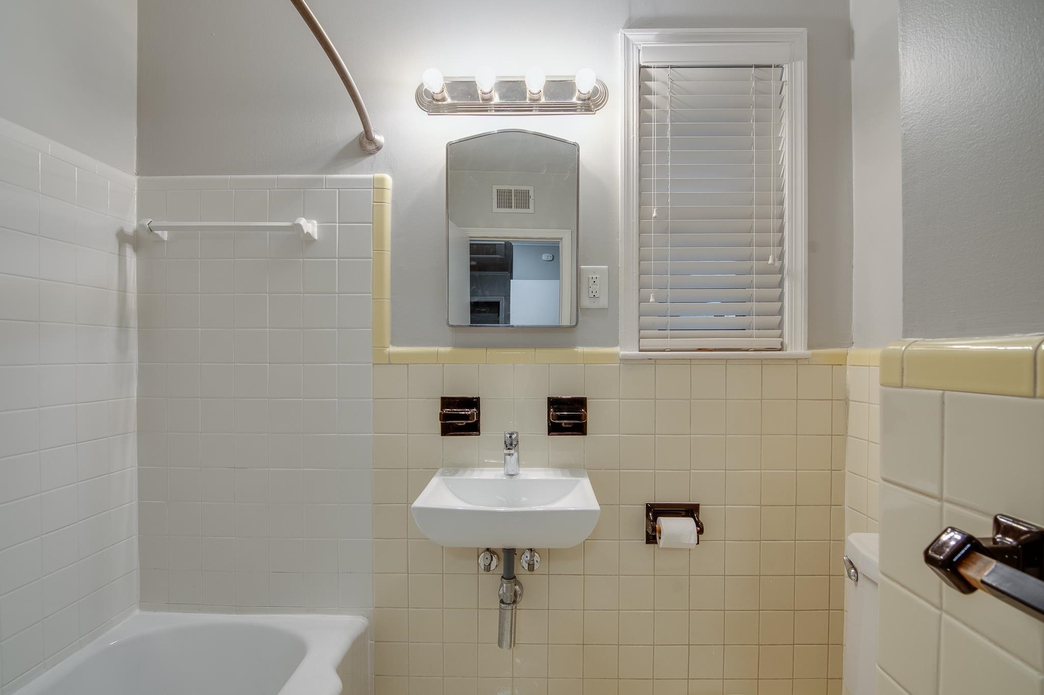 4970 Sequoia Road Memphis, TN 38117 - Photo 22 of 31 a bathroom with a sink a toilet and shower