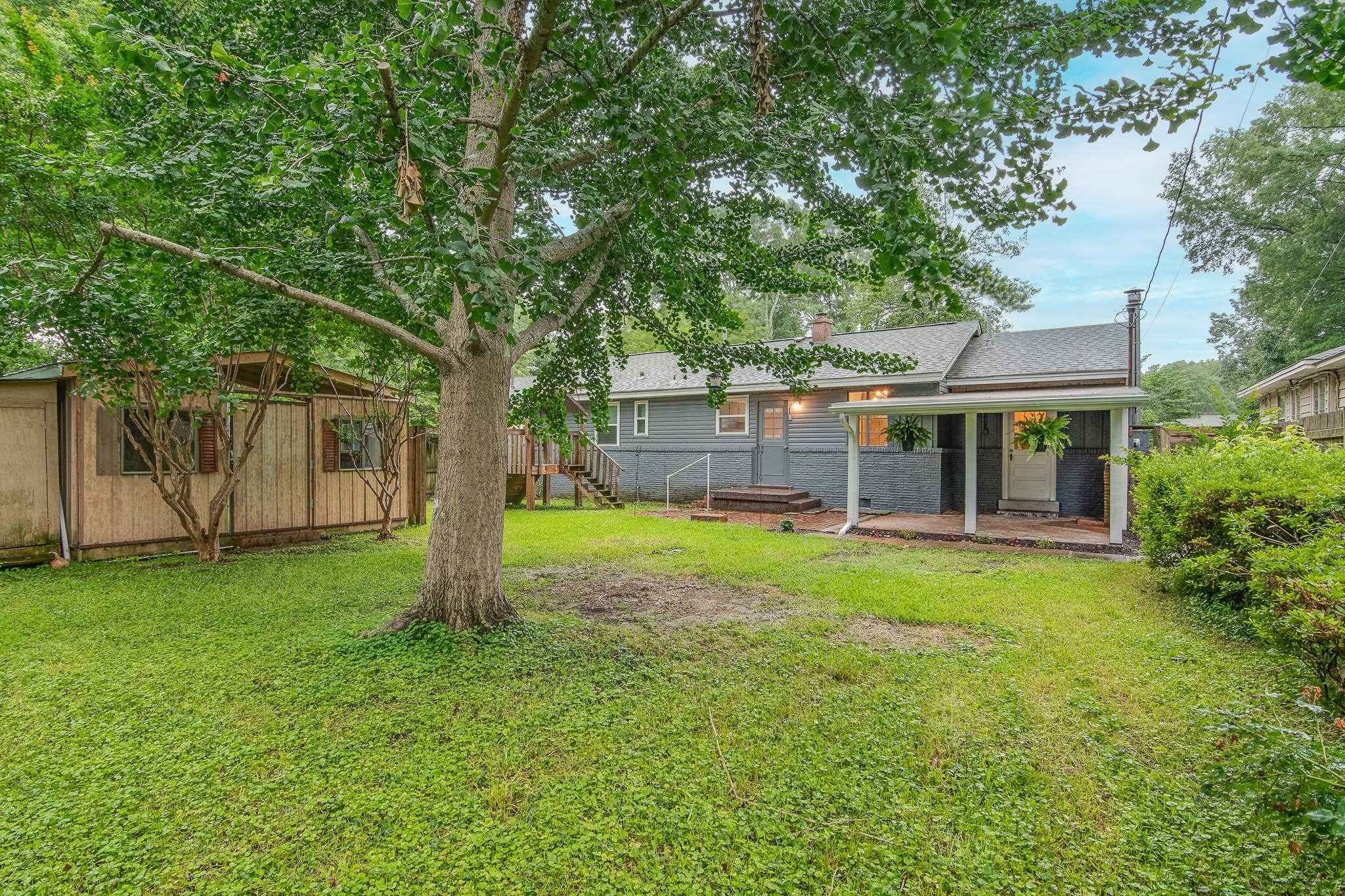 4970 Sequoia Road Memphis, TN 38117 - Photo 28 of 31 a view of a house with a backyard
