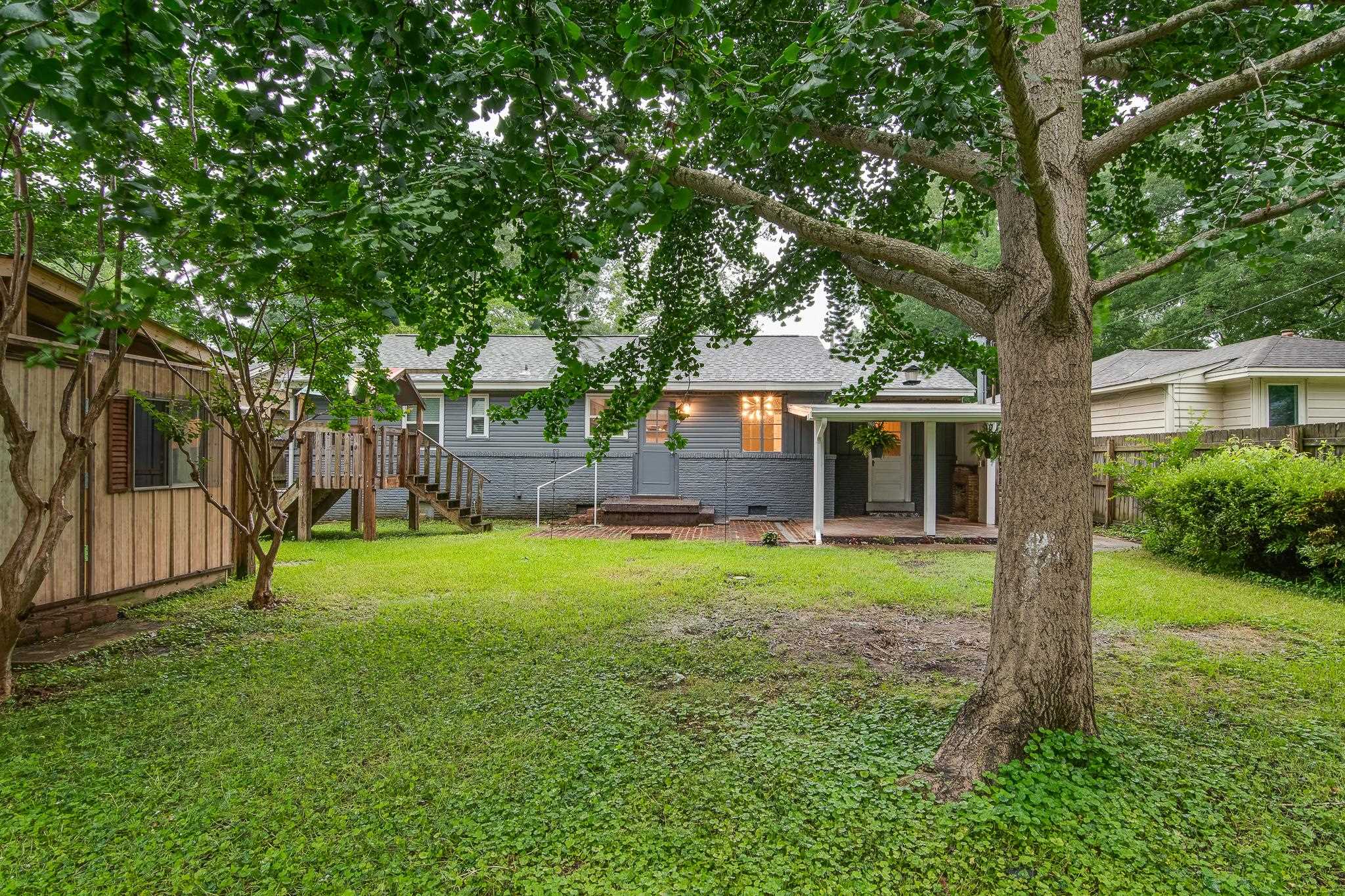 4970 Sequoia Road Memphis, TN 38117 - Photo 29 of 31 a front view of a house with a yard and trees