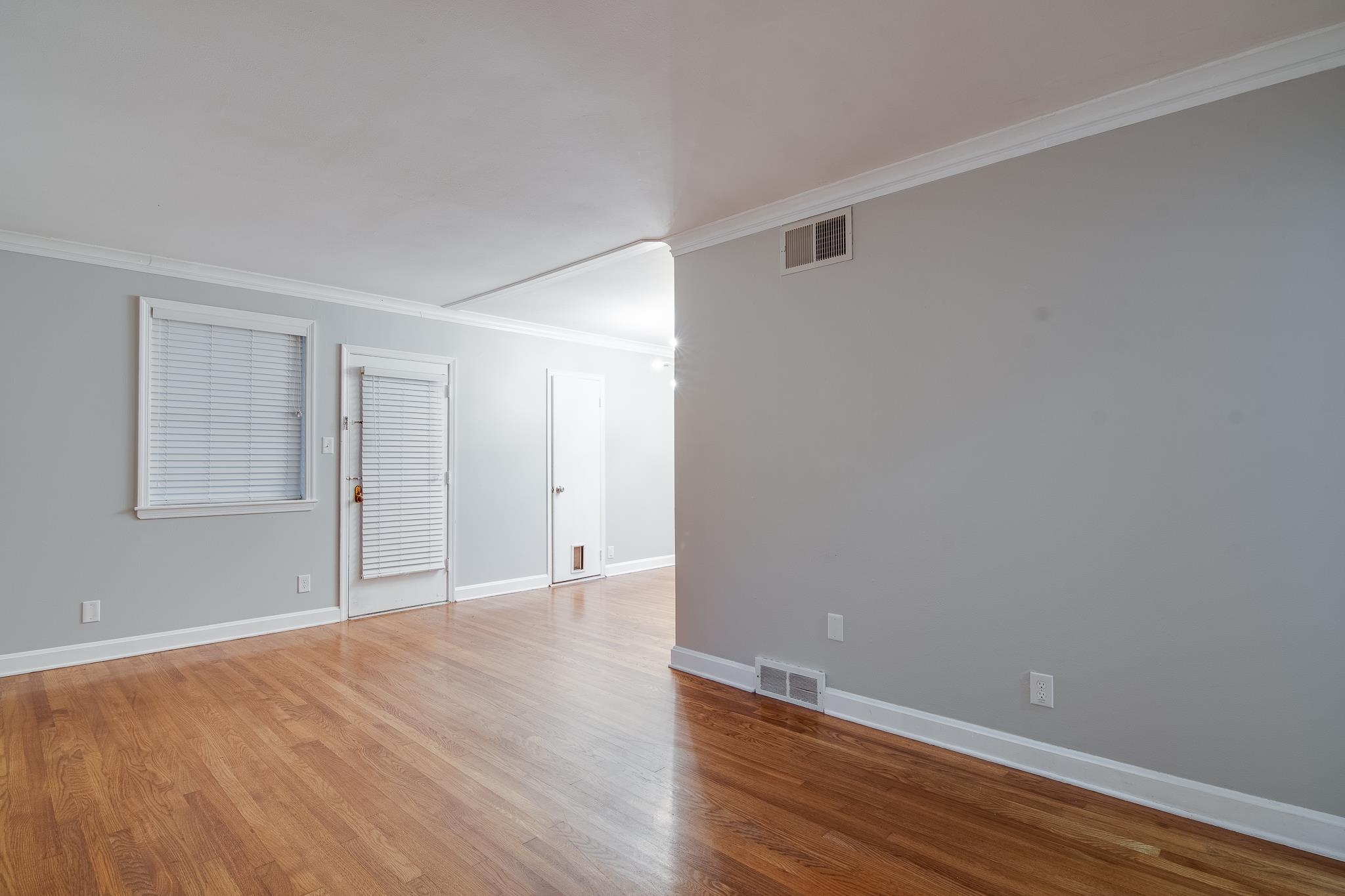 4970 Sequoia Road Memphis, TN 38117 - Photo 3 of 31 a view of an empty room with wooden floor