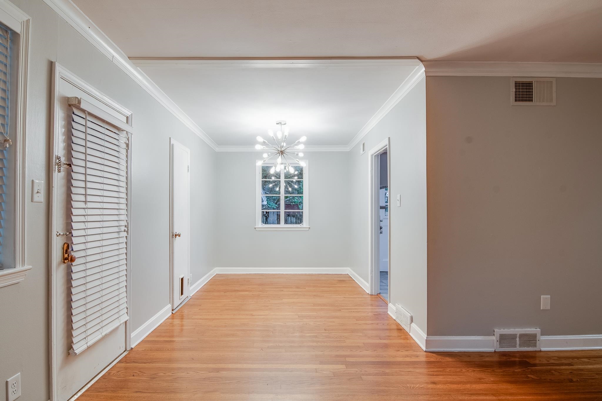 4970 Sequoia Road Memphis, TN 38117 - Photo 5 of 31 a view of livingroom with hardwood floor and hallway