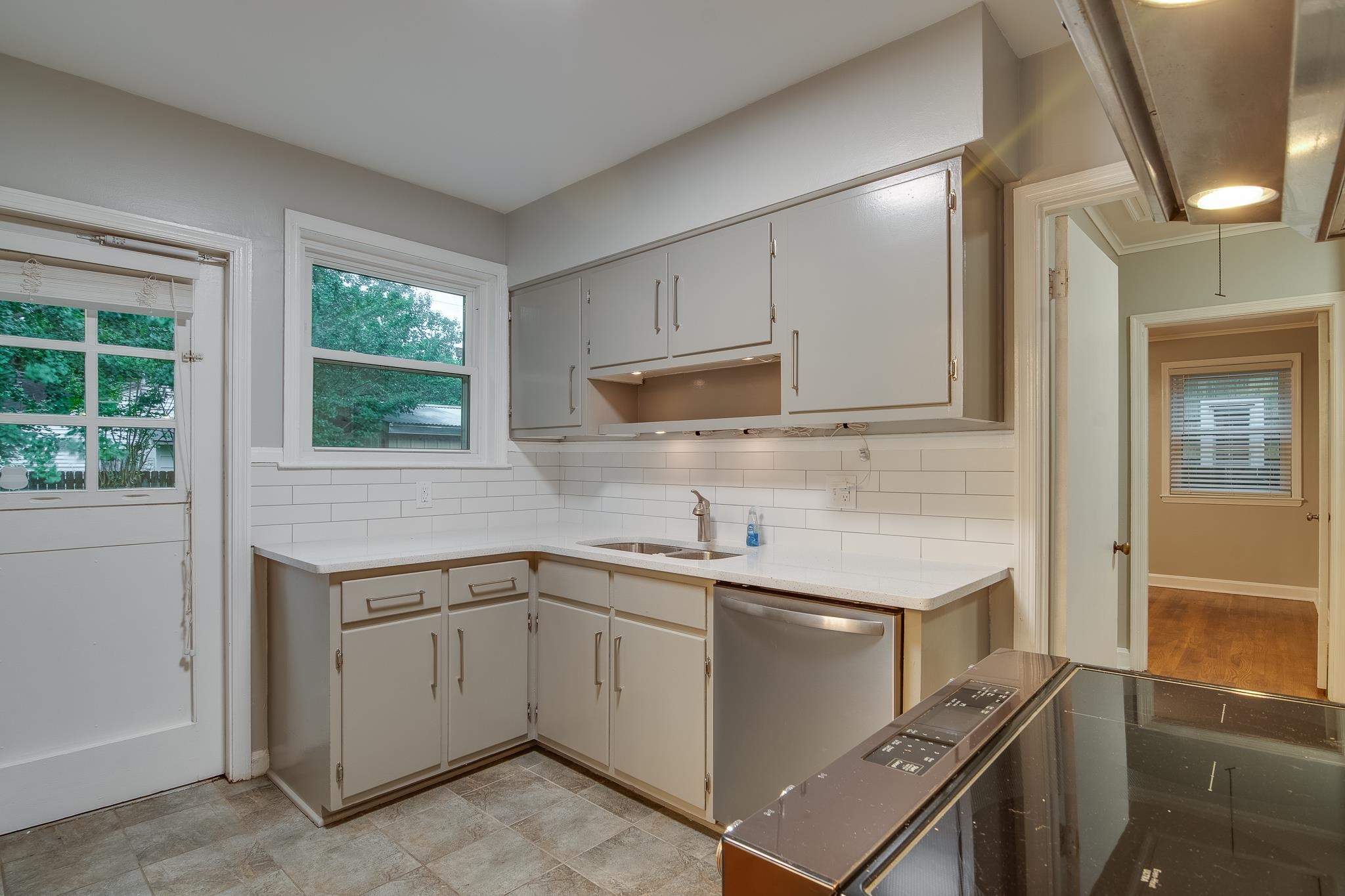 4970 Sequoia Road Memphis, TN 38117 - Photo 10 of 31 a kitchen with a sink cabinets and window