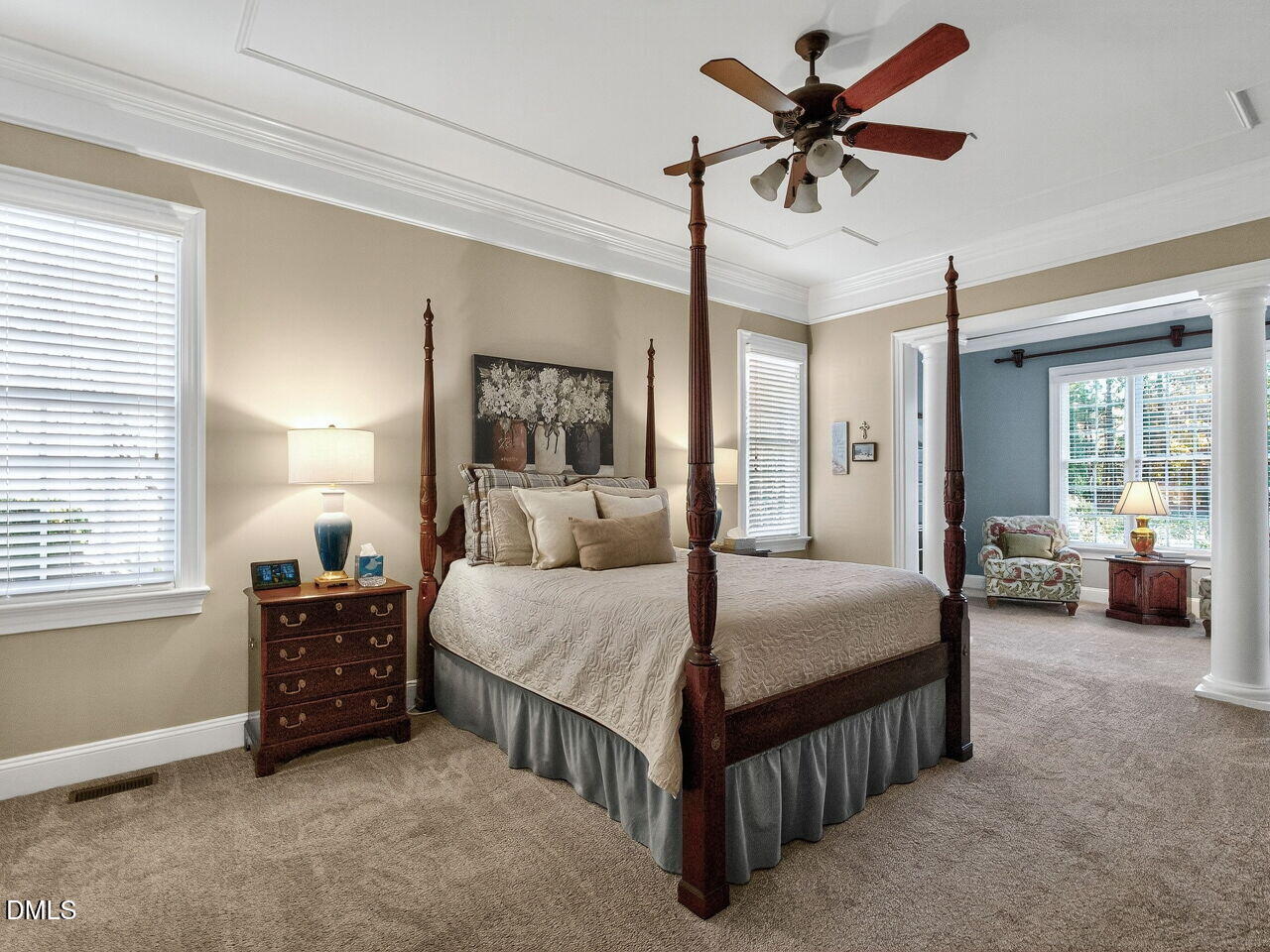 10312 Old Creedmoor Road Raleigh, NC 27613 - Photo 15 of 40 a bedroom with a bed a chandelier and a couch