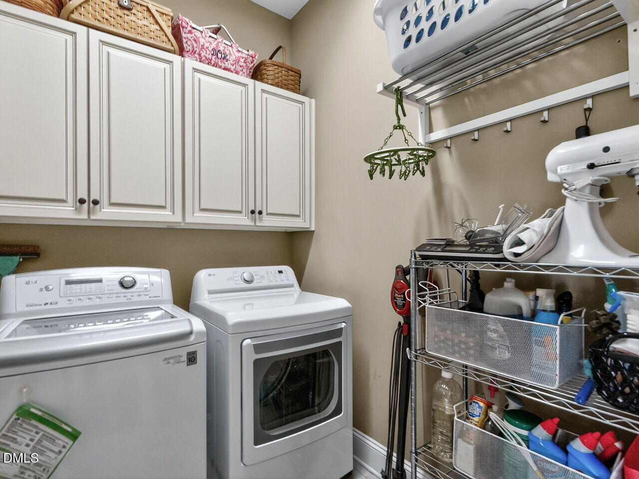 10312 Old Creedmoor Road Raleigh, NC 27613 - Photo 20 of 40 a utility room with dryer and washer