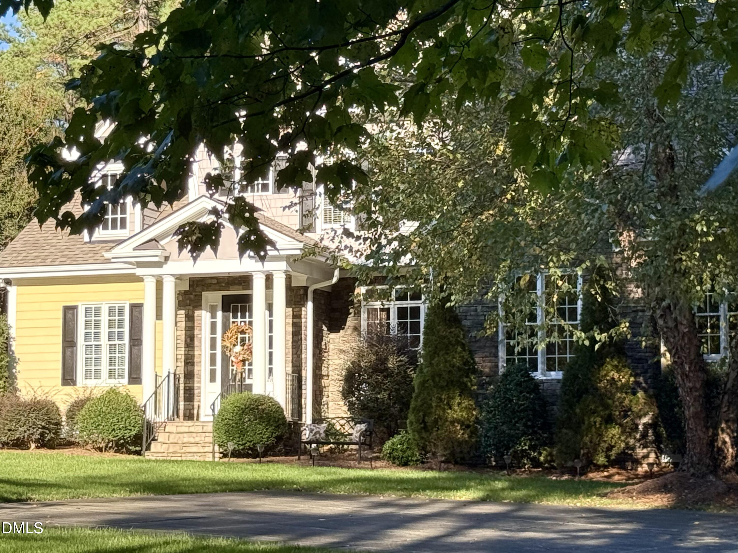 10312 Old Creedmoor Road Raleigh, NC 27613 - Photo 2 of 40 a front view of a house with a yard