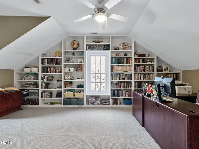 a view of a livingroom with furniture and staircase