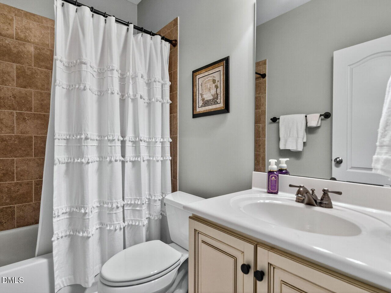 10312 Old Creedmoor Road Raleigh, NC 27613 - Photo 24 of 40 a bathroom with a sink toilet and shower