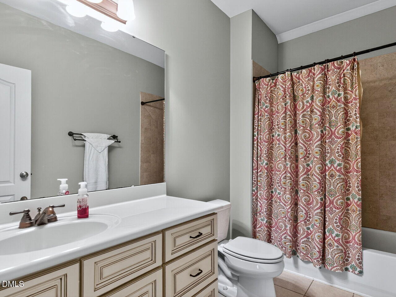 10312 Old Creedmoor Road Raleigh, NC 27613 - Photo 26 of 40 a bathroom with a granite countertop sink a toilet and a mirror