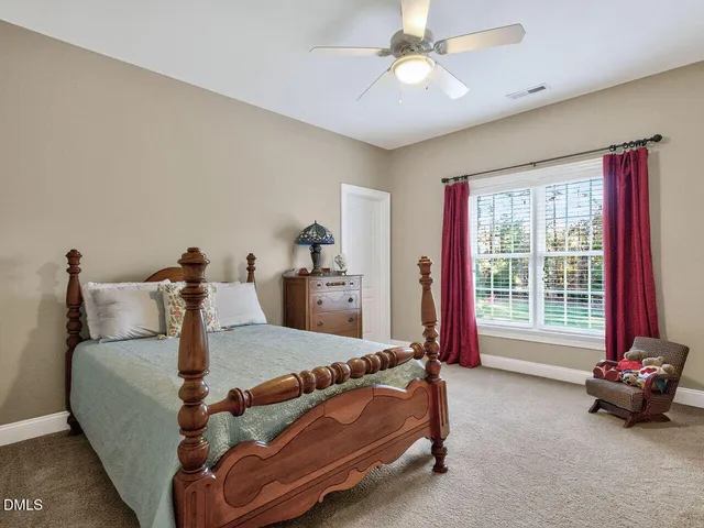 a bed room with a bed and a window