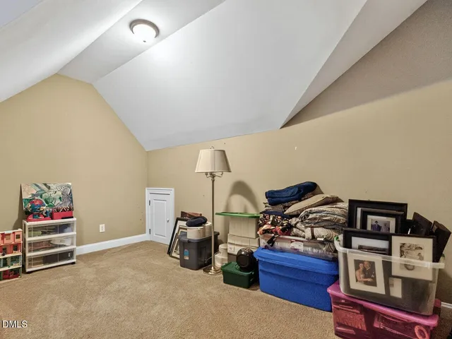 a living room with furniture and gym equipment