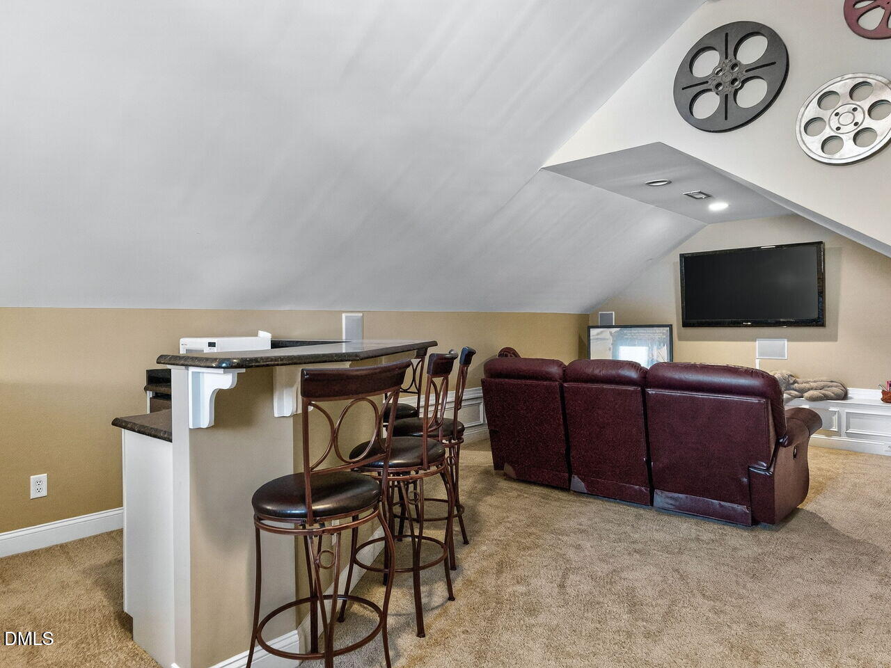 10312 Old Creedmoor Road Raleigh, NC 27613 - Photo 30 of 40 a view of a livingroom with furniture and a bookshelf