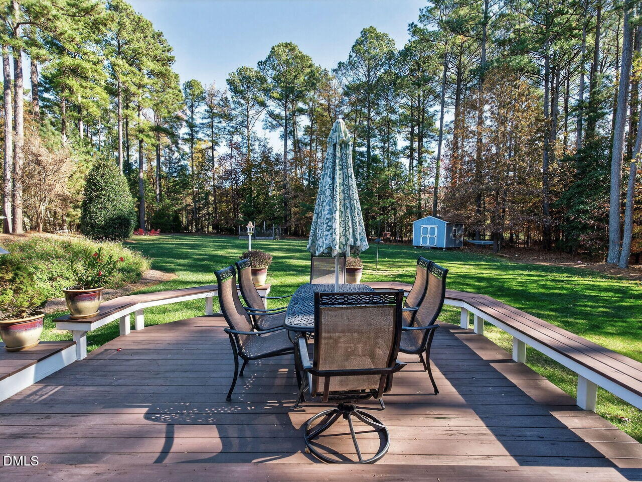 10312 Old Creedmoor Road Raleigh, NC 27613 - Photo 34 of 40 a view of a table and chairs in the garden
