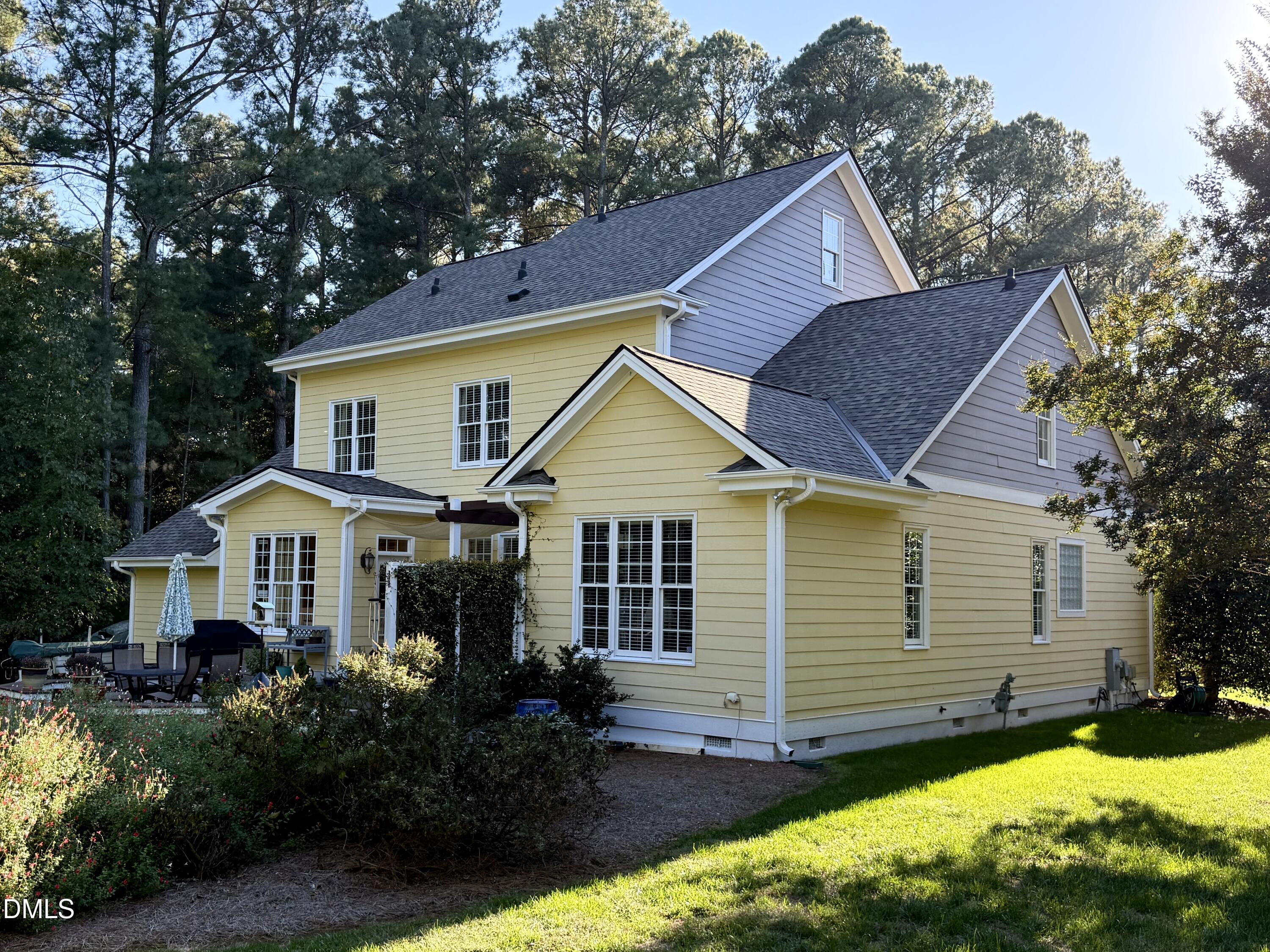 10312 Old Creedmoor Road Raleigh, NC 27613 - Photo 39 of 40 a front view of house with yard and green space
