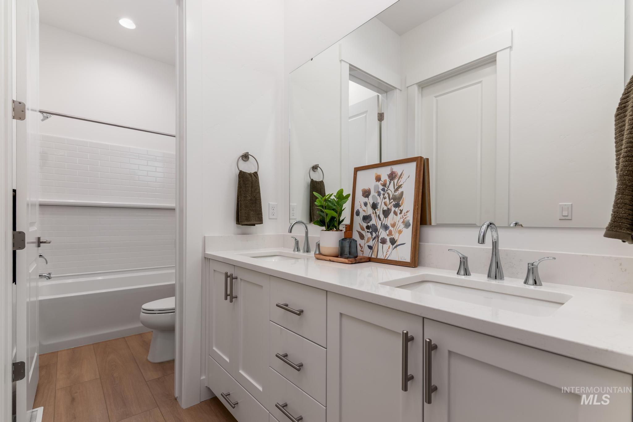 9074 West Moonglade Street Star, ID 83669 - Photo 26 of 40 Bathroom featuring a dual vanity with white cabinetry, integrated sinks, and polished chrome faucets