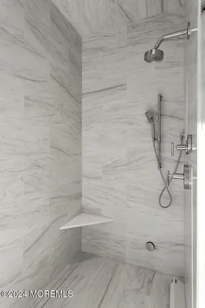 a bathroom with a sink mirror and a toilet