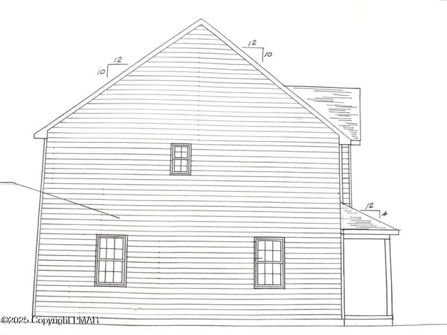 a view of a white house next to a white wall