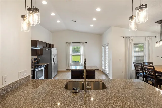 a view of a livingroom with furniture window and wooden floor