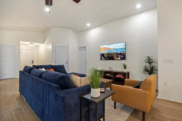 a living room with furniture and a fireplace