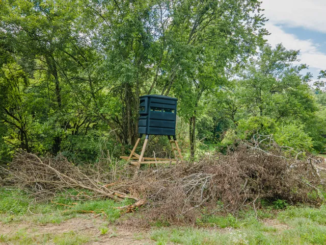 a backyard of a house with a yard and outdoor seating