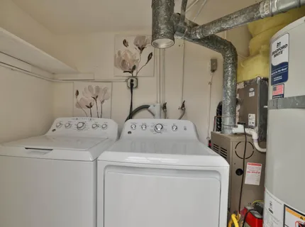a utility room with dryer and washer