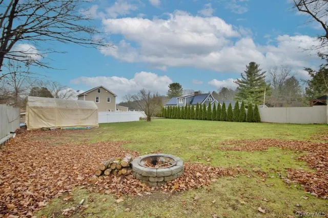 a backyard of a house with lots of green space