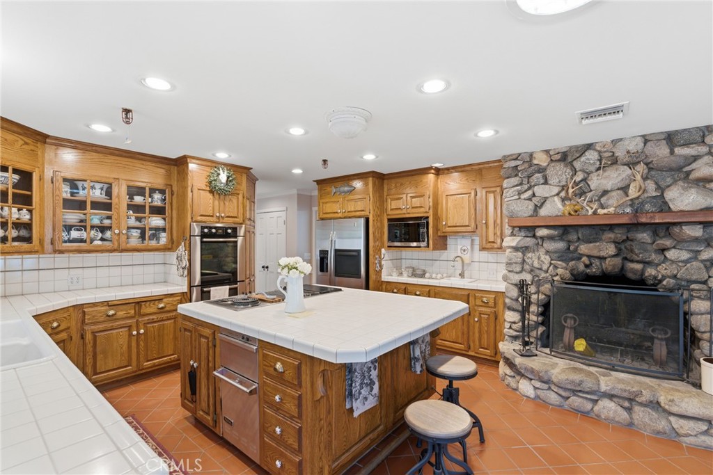 9130 Old Stage Road Agua Dulce, CA 91390 - Photo 20 of 74 a kitchen with stainless steel appliances granite countertop a stove and a sink