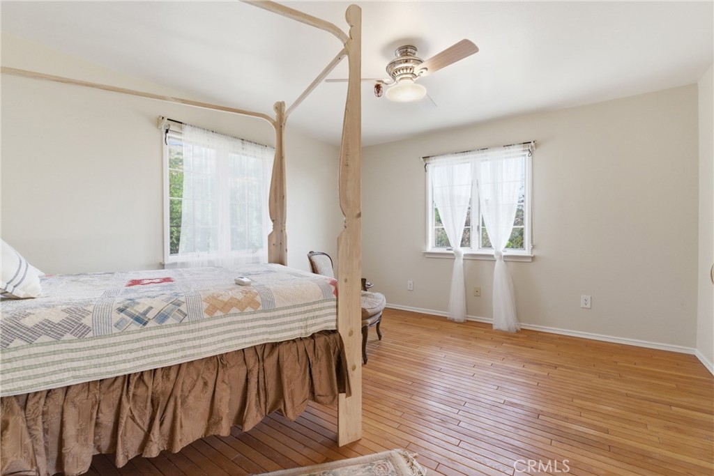9130 Old Stage Road Agua Dulce, CA 91390 - Photo 46 of 74 a bedroom with furniture and wooden floor
