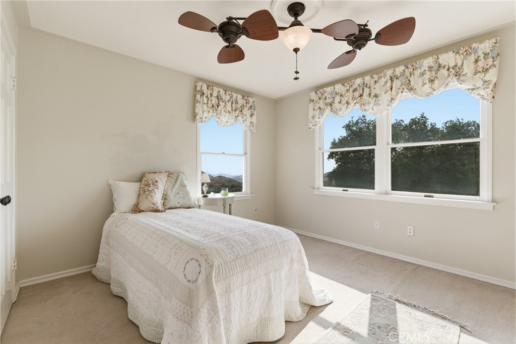 9130 Old Stage Road Agua Dulce, CA 91390 - Photo 50 of 74 a bedroom with a large bed and a window