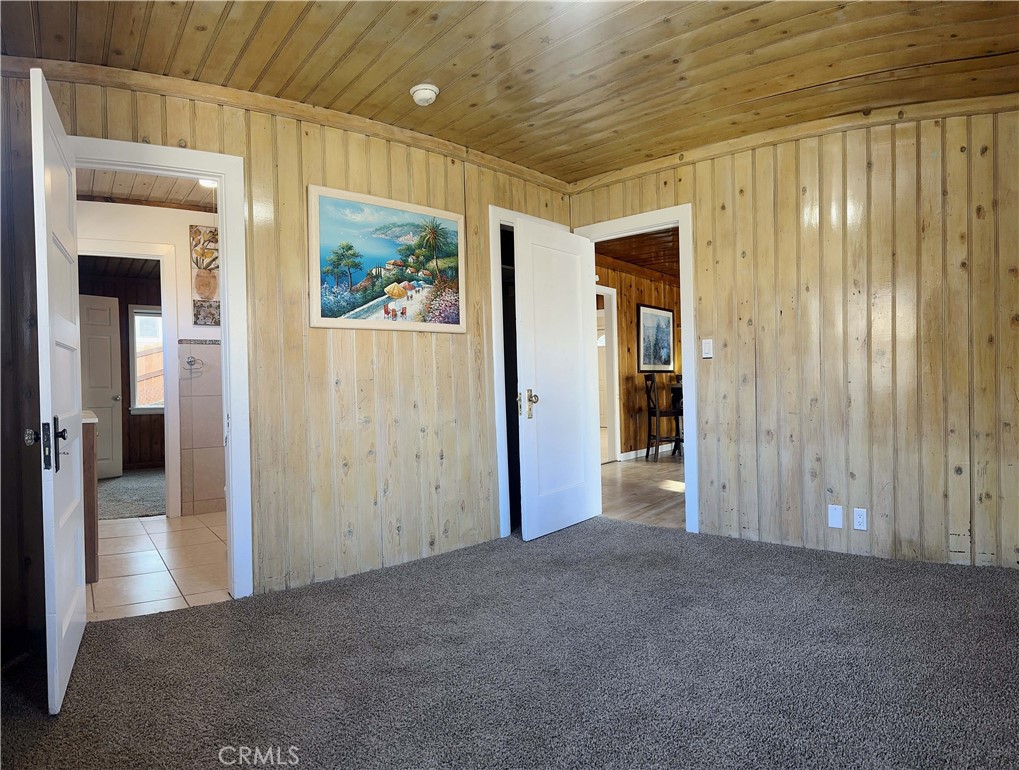 505 North Drive Lebec, CA 93243 - Photo 13 of 34 a view of a hallway with wooden shelves