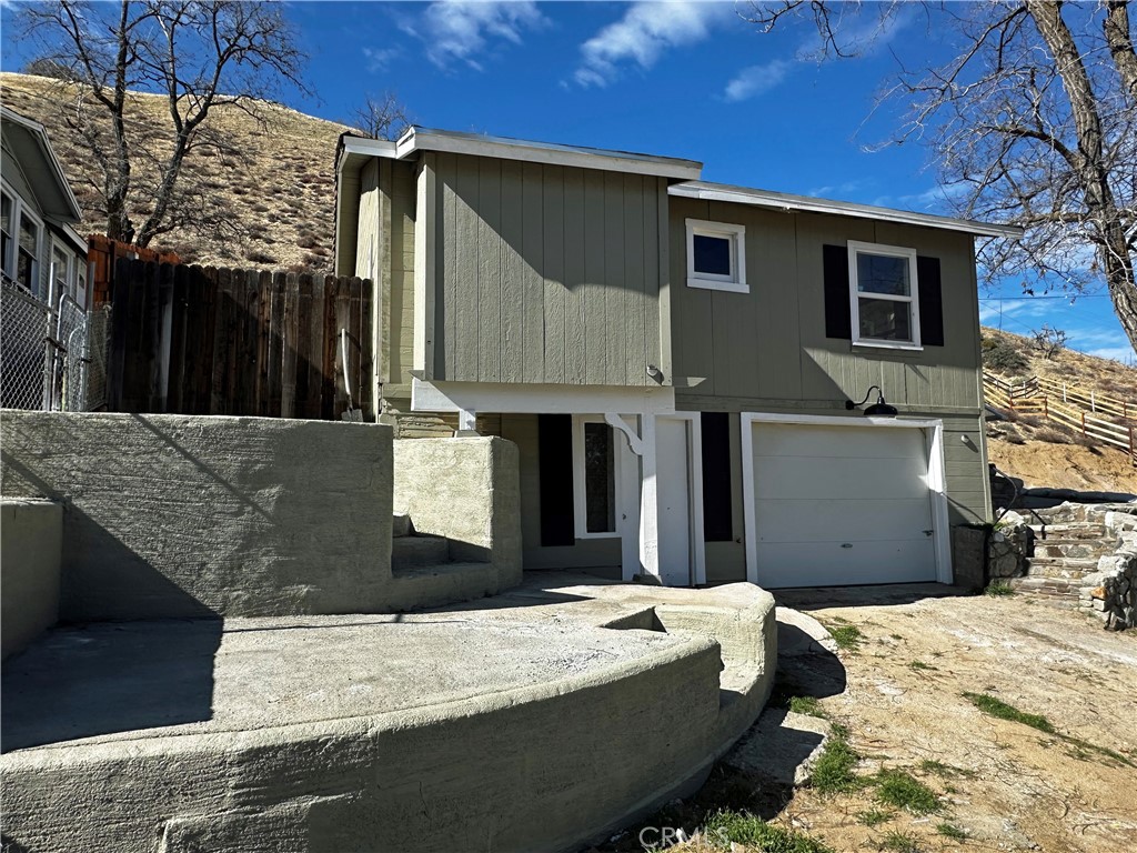 505 North Drive Lebec, CA 93243 - Photo 3 of 34 a bed room with a bed and a television