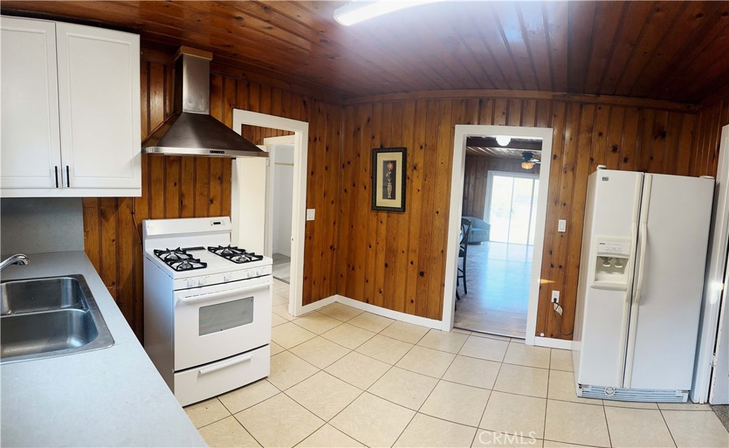 505 North Drive Lebec, CA 93243 - Photo 7 of 34 a kitchen with stainless steel appliances a stove a refrigerator and cabinets
