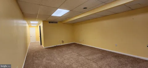 a walk in closet with empty racks