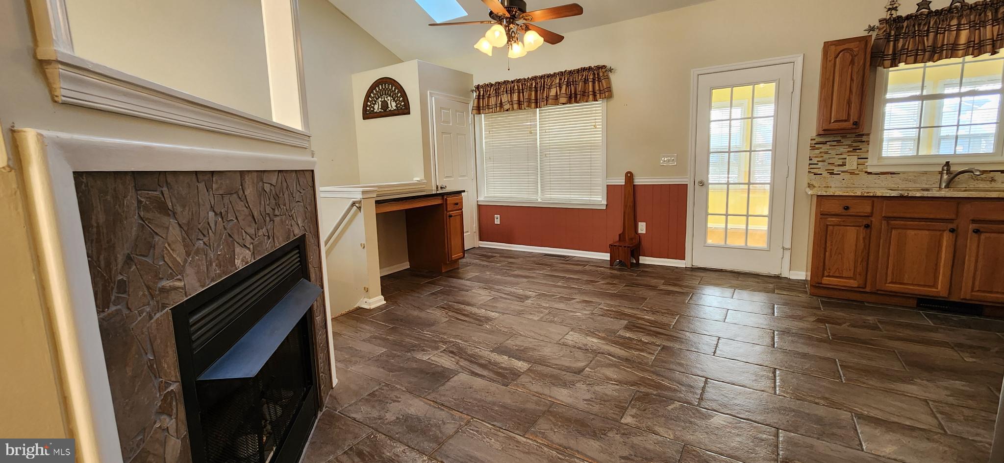 17010 Minos Conaway Road Lewes, DE 19958 - Photo 5 of 28 a view of an empty room with window and wooden floor