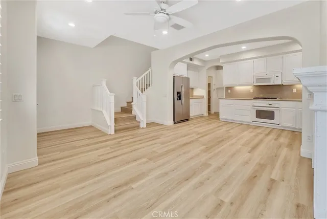a view of kitchen with sink and wooden floor
