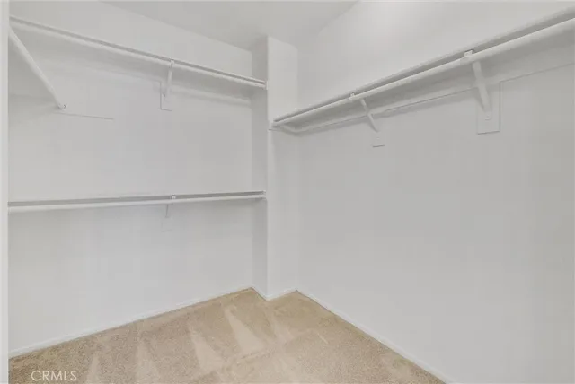 a view of an empty walk in closet