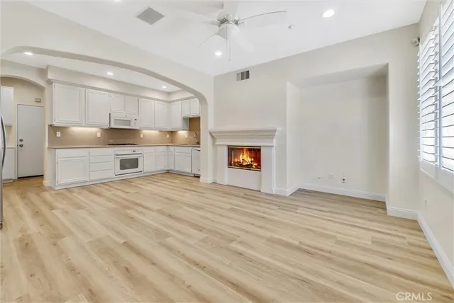 a room with a bed and a fireplace