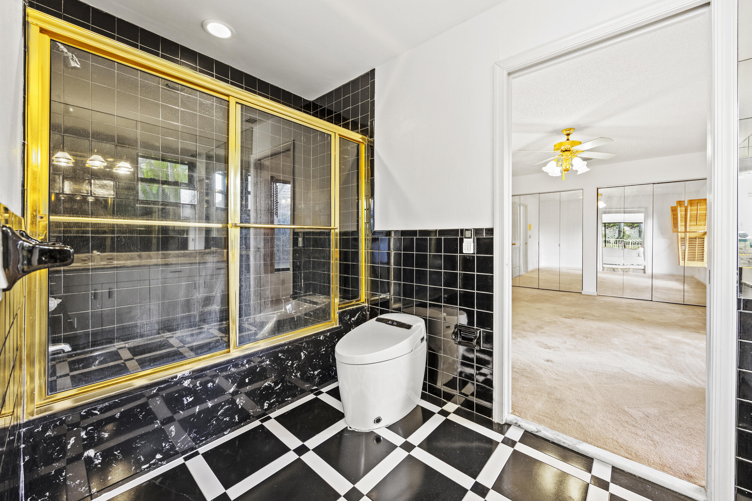 10747 Stonebridge Boulevard Boca Raton, FL 33498 - Photo 40 of 75 a bathroom with a toilet and a shower