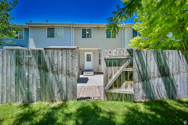 1799 West 1110th Street North Provo, UT 84604 - Photo 24 of 24 Private fenced yard featuring a gate entrance and brick paver pathway