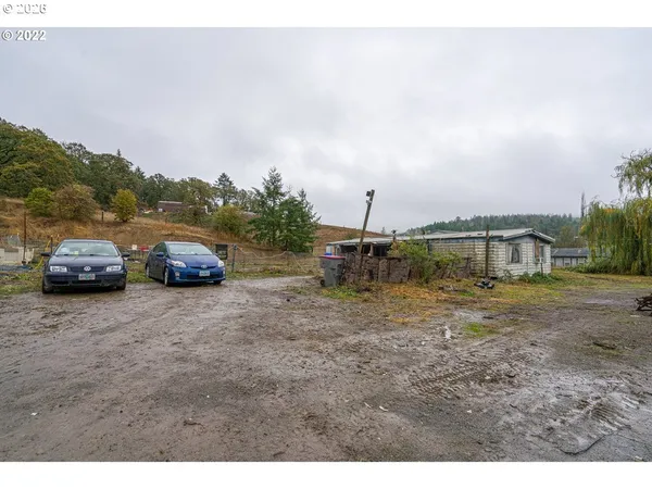 a view of lake with a yard