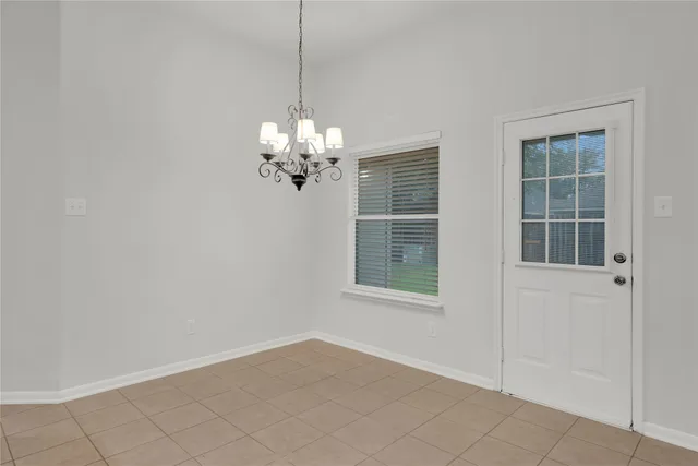 a view of an empty room with windows