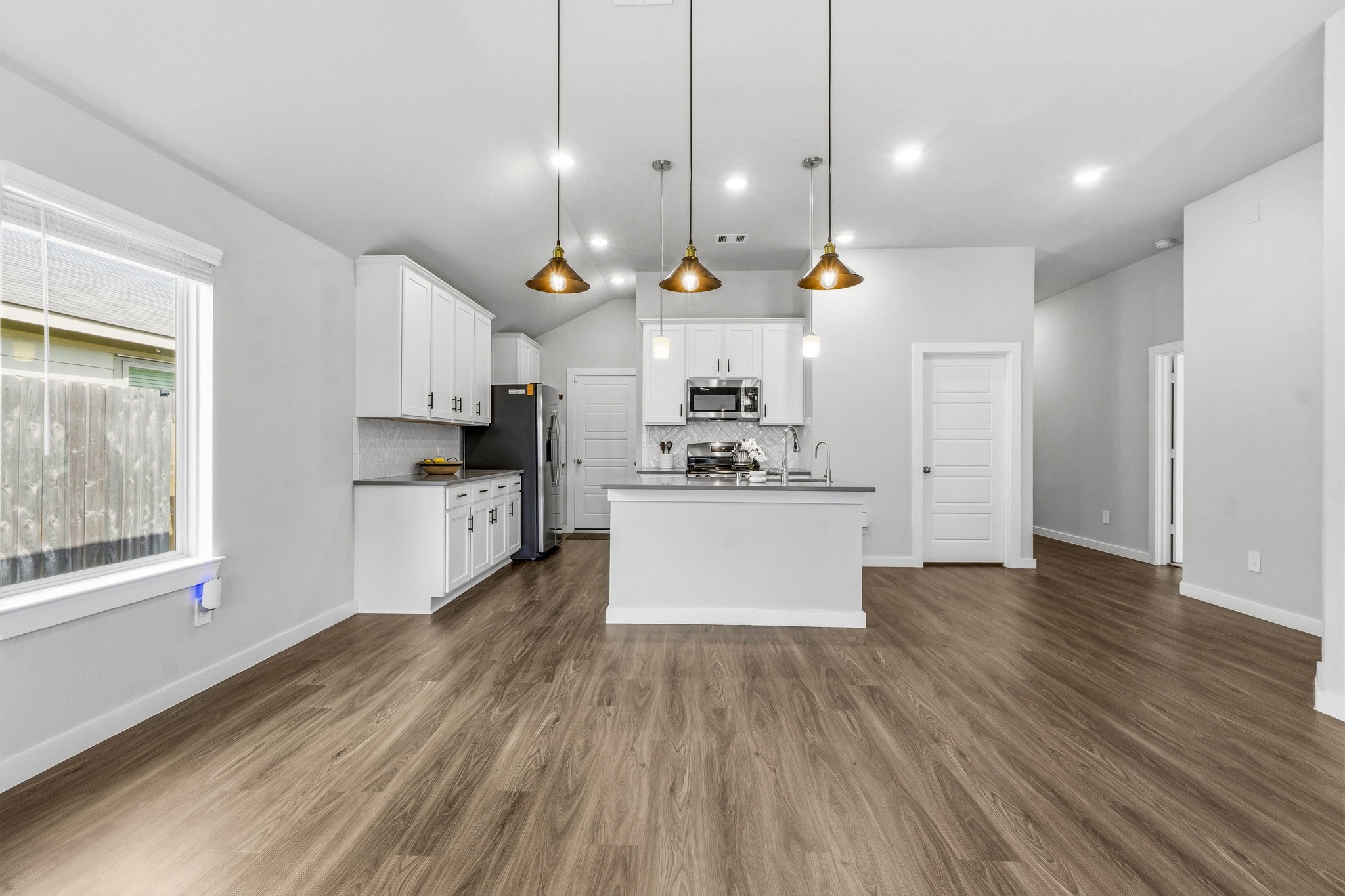 22235 Cardinal Crest Lane New Caney, TX 77357 - Photo 10 of 41 Elegant dining area enhanced with an upgraded light fixture, adding a stylish focal point that's perfect for everyday meals and special occasions.